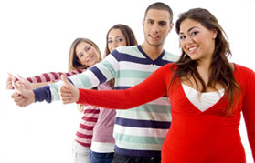 Young people giving the thumbs up [image courtesy of Ambrose/FreeDigitalPhotos.net